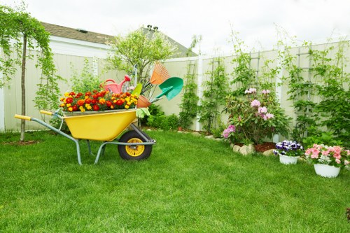 Workers sorting garden waste into recycling bins in Manor Park